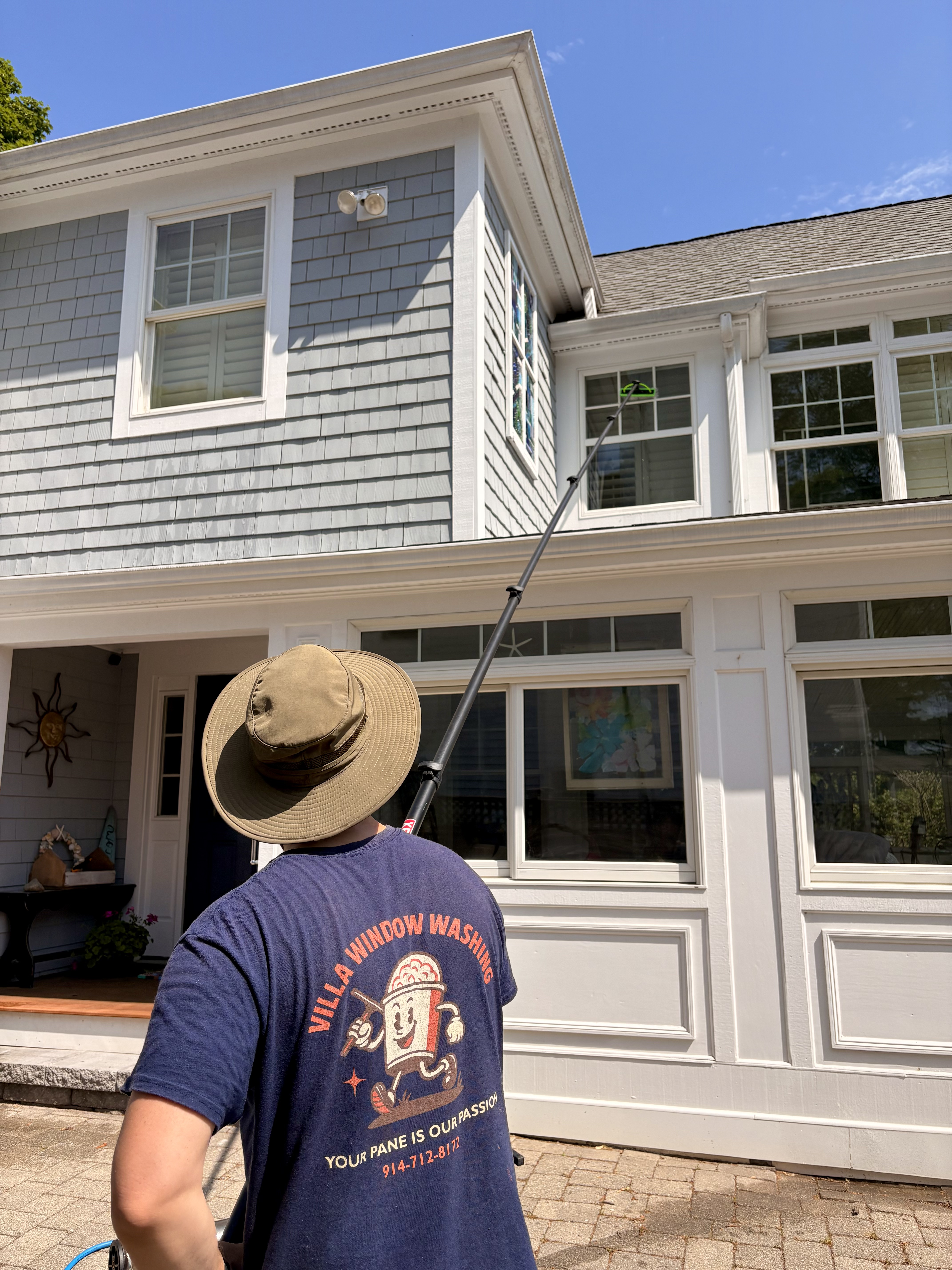 Residential water-fed window cleaning in progress